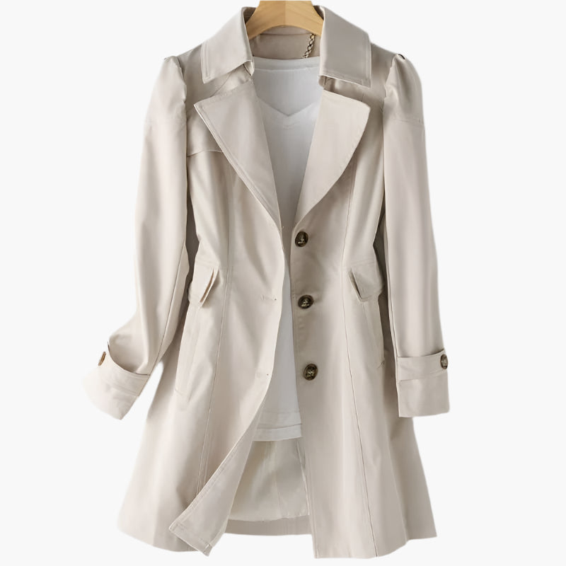 Beige tailored trench coat featuring a sharp lapel collar, statement buttons, and a flattering mid-length silhouette.