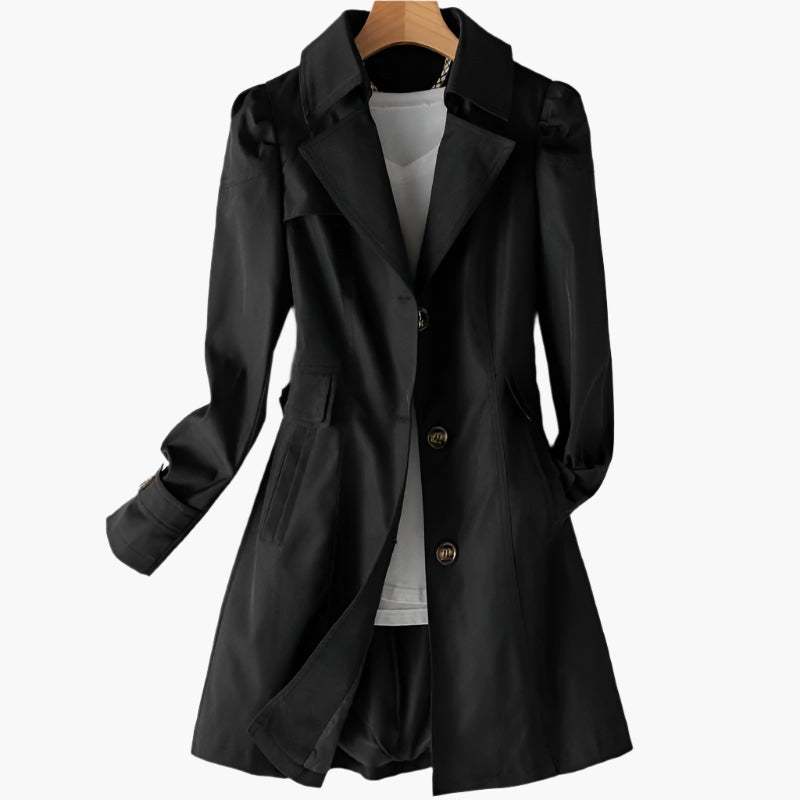 Classic black tailored trench coat featuring a sharp lapel collar, statement buttons, and a flattering mid-length silhouette.