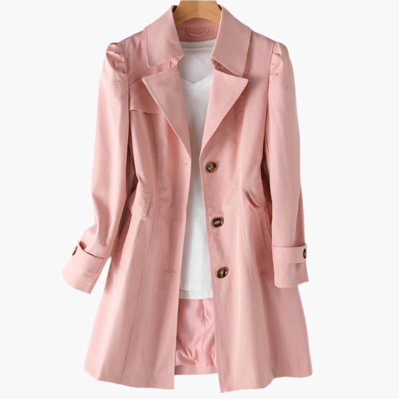 Penelope classic pink tailored trench coat featuring a sharp lapel collar, button front, and flattering mid-length silhouette.