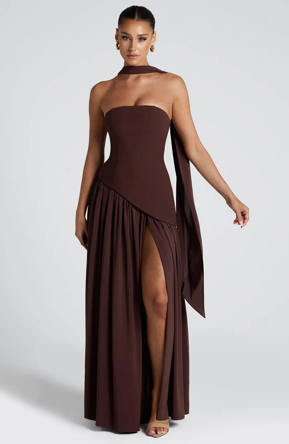 Phoebe women's chocolate brown corset bustier maxi dress with high slit and draped scarf detail.