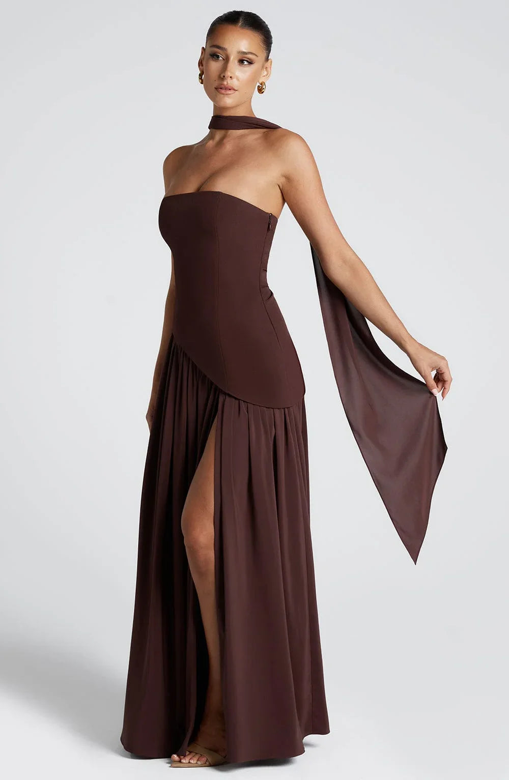 Phoebe women's chocolate brown corset bustier maxi dress with high slit and draped scarf detail.