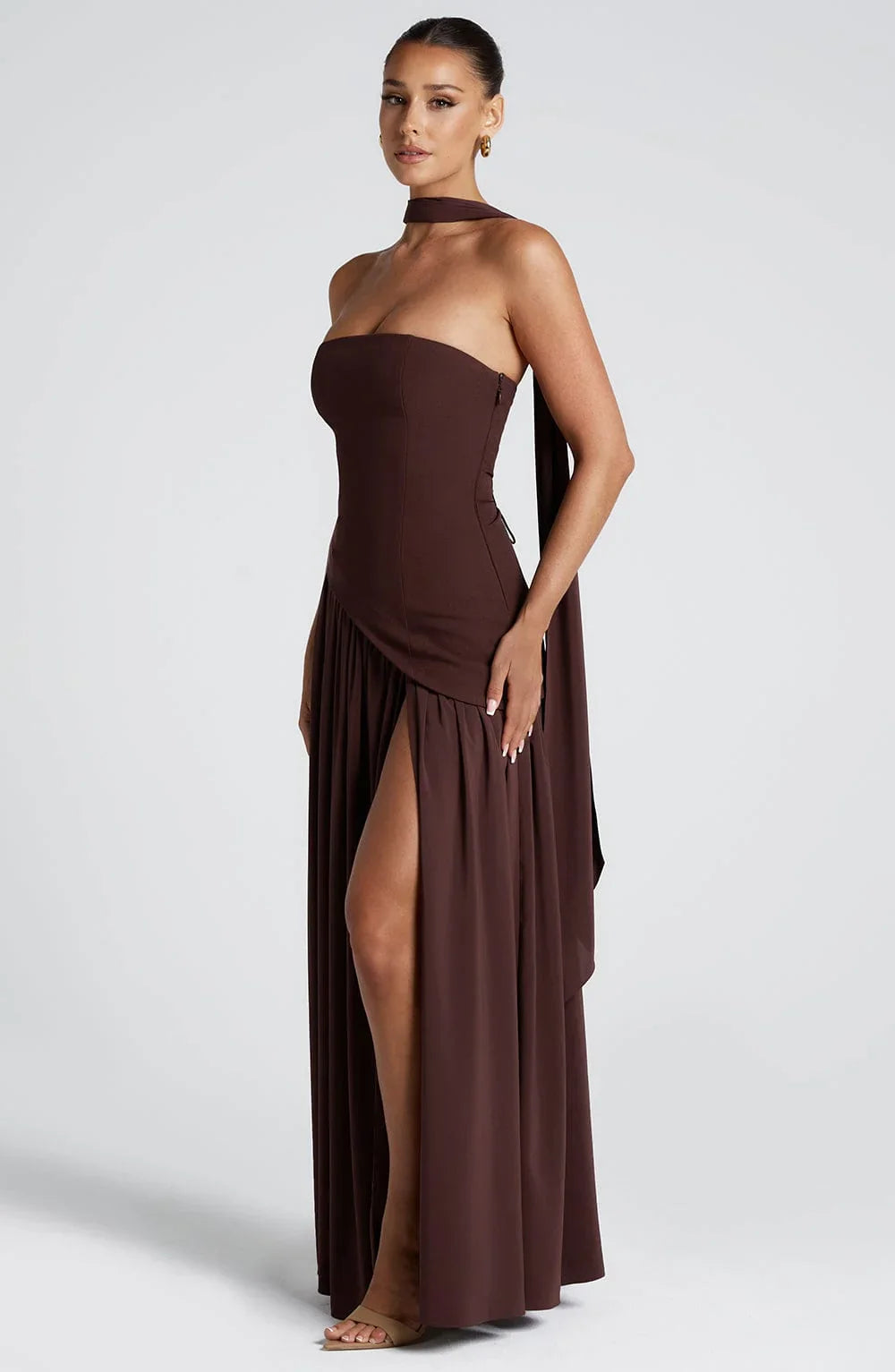 Phoebe women's brown strapless corset bustier maxi dress with high slit and draped scarf detail.