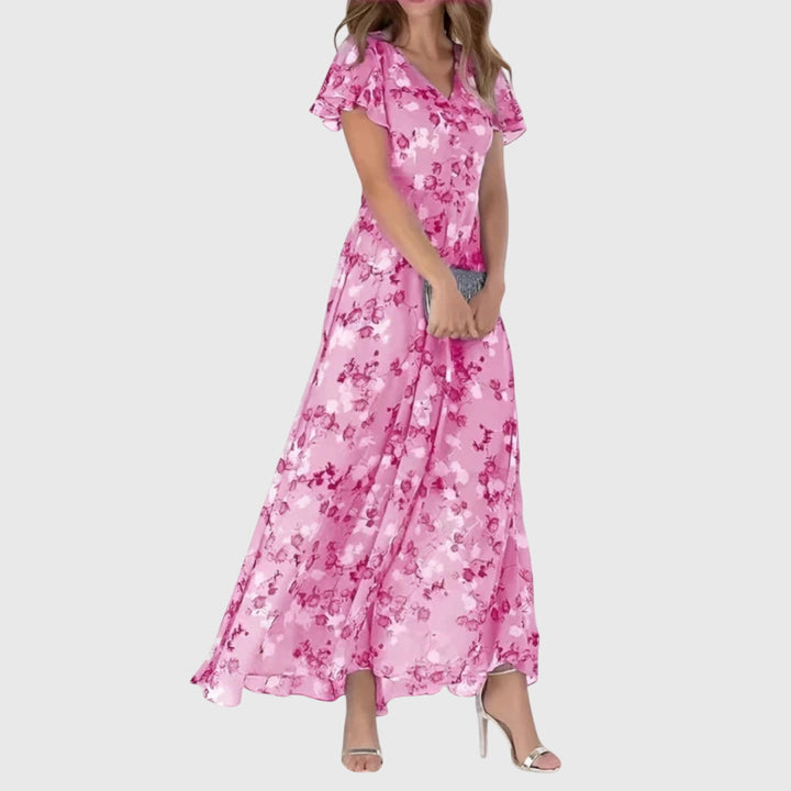 Phoebe women's figure-flattering midi dress in vibrant pink floral print, with tailored lines and flutter sleeves.