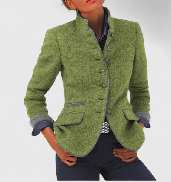 Olive green tailored blazer with a stand collar, button-front closure, grey contrast trim, and flap pockets.