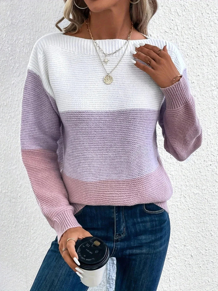 Women's chunky knit jumper featuring a white, lilac, and pink colour block design with a wide boat neckline.