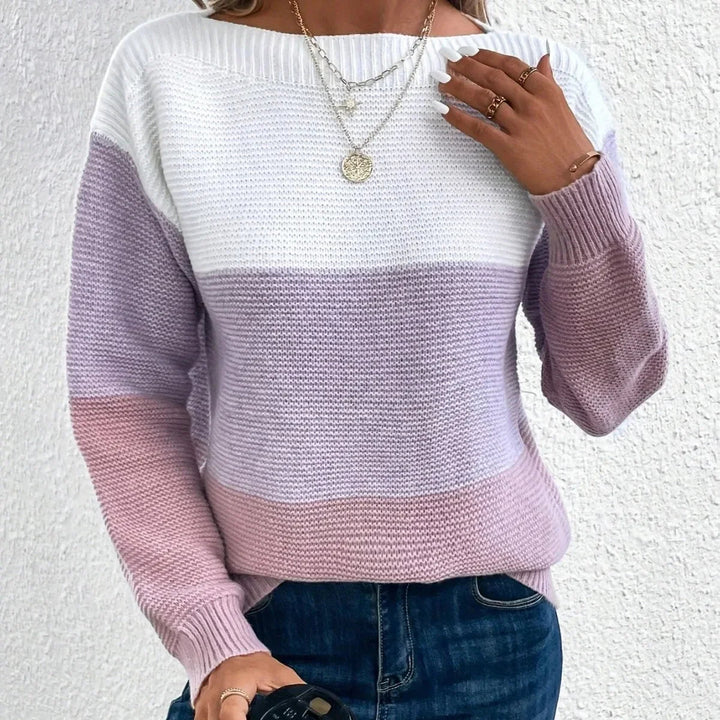 Women's chunky knit jumper featuring a white, lilac, and pink colour block design with a relaxed boat neckline.
