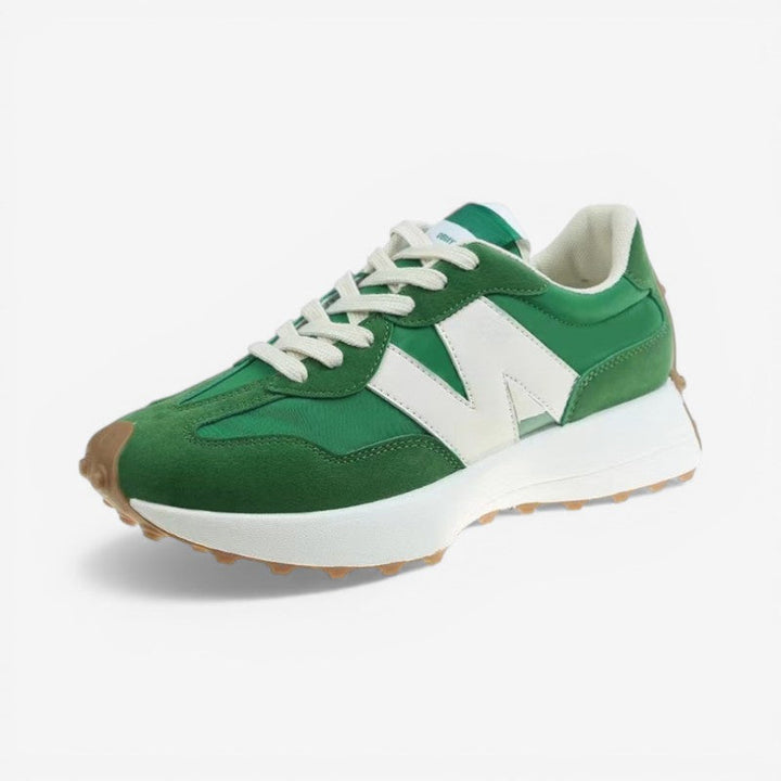 Green and white retro lace-up trainers with mixed-panel suede and nylon upper, white side detail, and a textured gum sole.