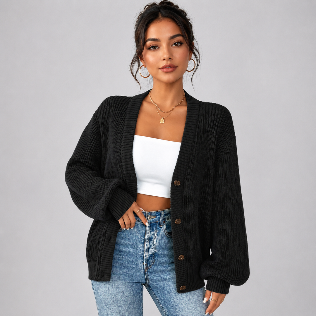 Black ribbed knit cardigan with a V-neck, front button closure, and relaxed oversized fit for effortless layering.