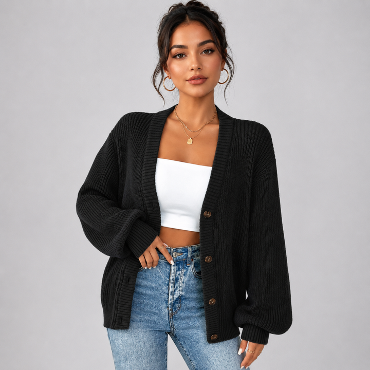 Black ribbed knit cardigan with a V-neck, front button closure, and relaxed oversized fit for effortless layering.