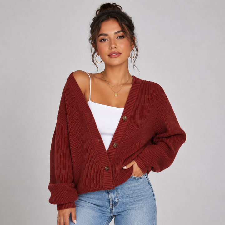 Burgundy ribbed knit cardigan with a V-neck, front buttons, and a relaxed, oversized fit for effortless layering.