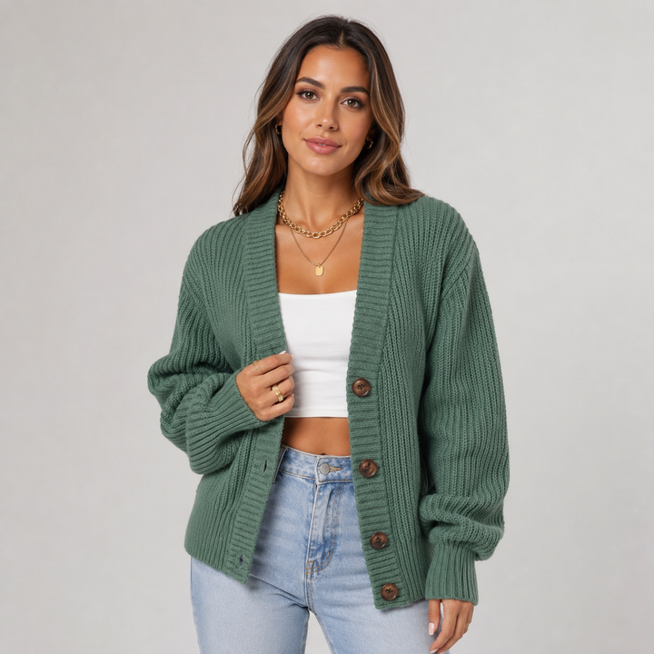 Green ribbed knit cardigan with a V-neck, button-front closure, and relaxed oversized fit for effortless layering.