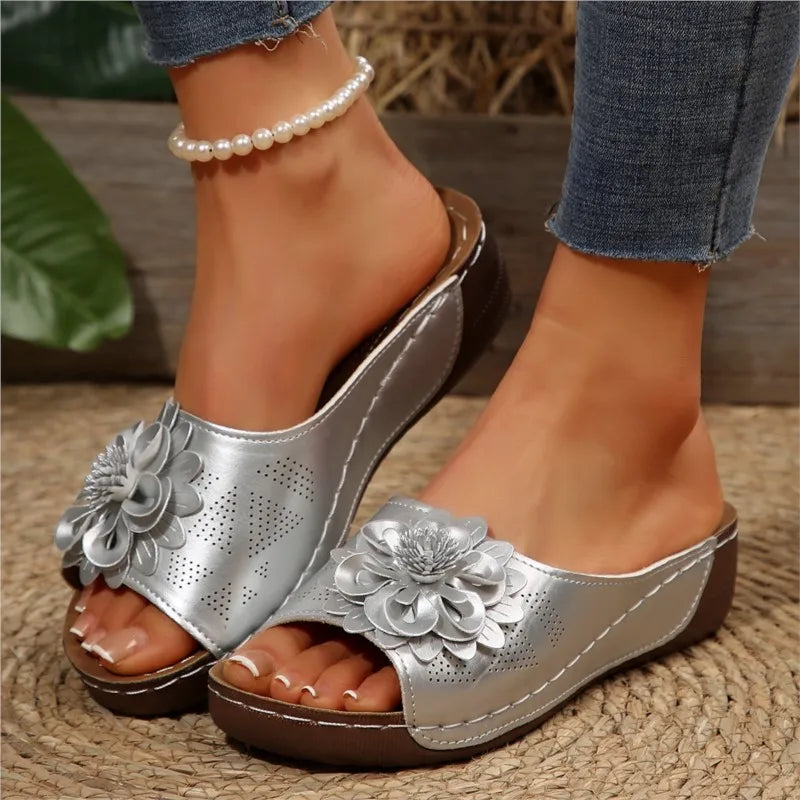 Silver Poppy women's slip-on wedge sandals with floral upper detail and cushioned footbed.