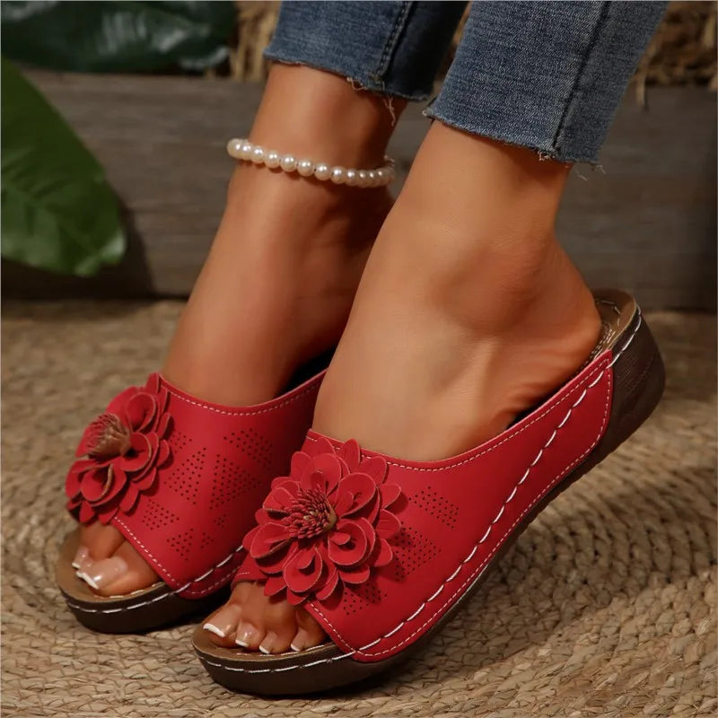 Red Poppy women's slip-on wedge sandals with delicate floral upper detail and cushioned footbed.