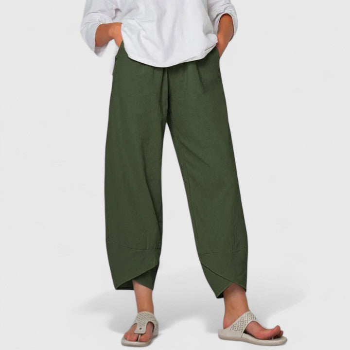 Poppy women's wide-leg trousers in rich olive green, featuring a relaxed fit, flowing drape, and handy pockets.