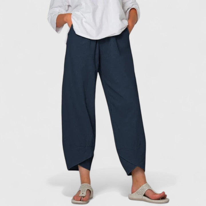 Poppy women's wide-leg trousers in a rich navy, featuring a relaxed fit, flowing drape, and handy pockets.