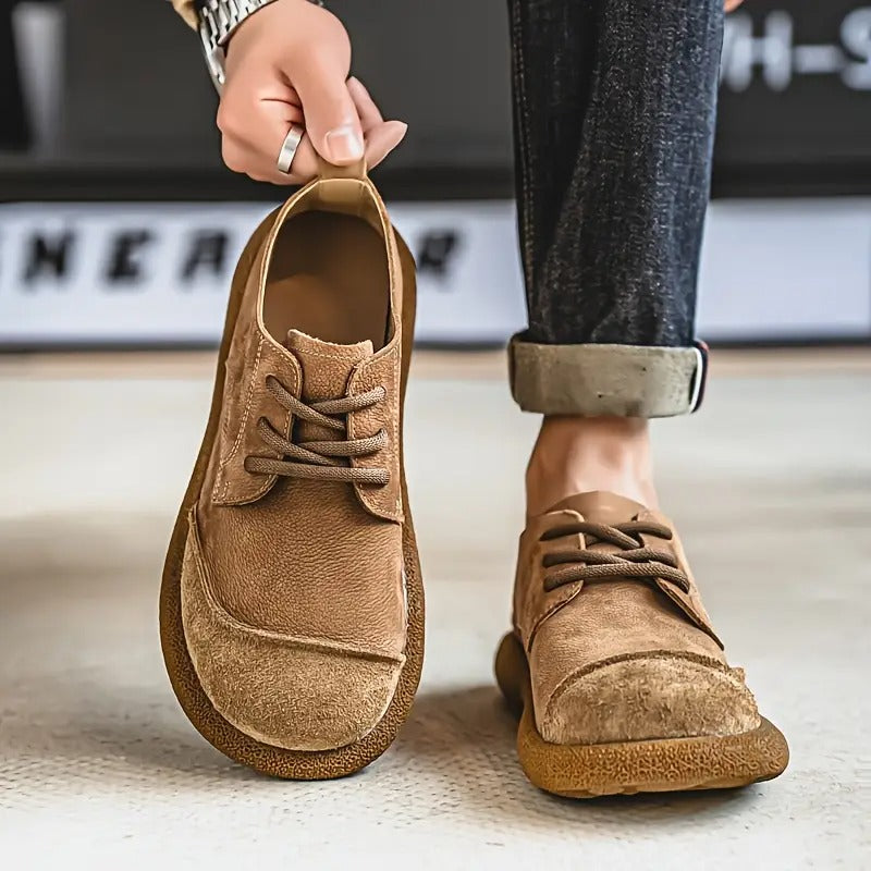 Tan leather lace-up walking shoes for men with a rounded toe, textured suede-like accents, and a cushioned, durable sole.