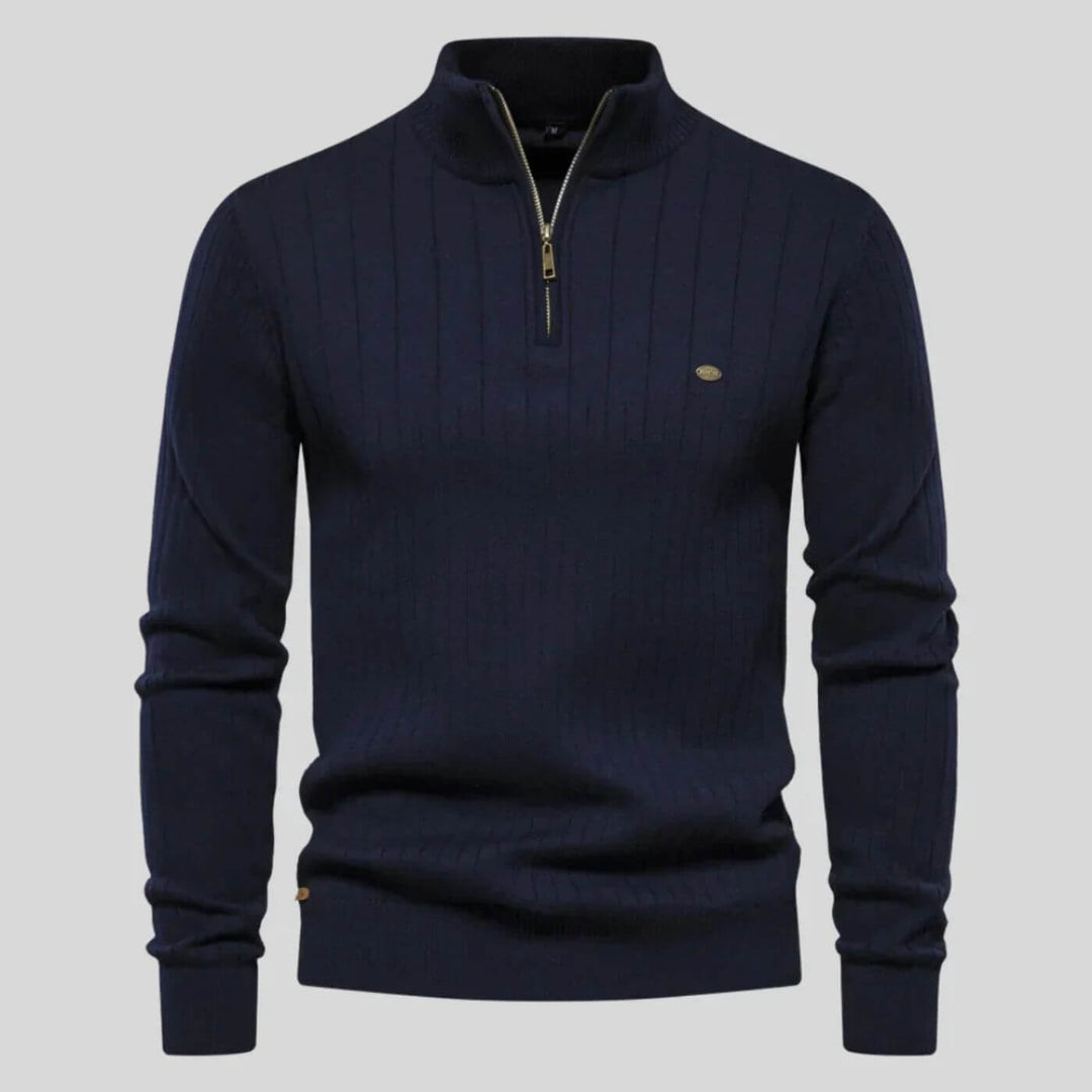 Navy blue men's ribbed half-zip knit jumper with a high collar, long sleeves, and a subtle metallic chest logo.