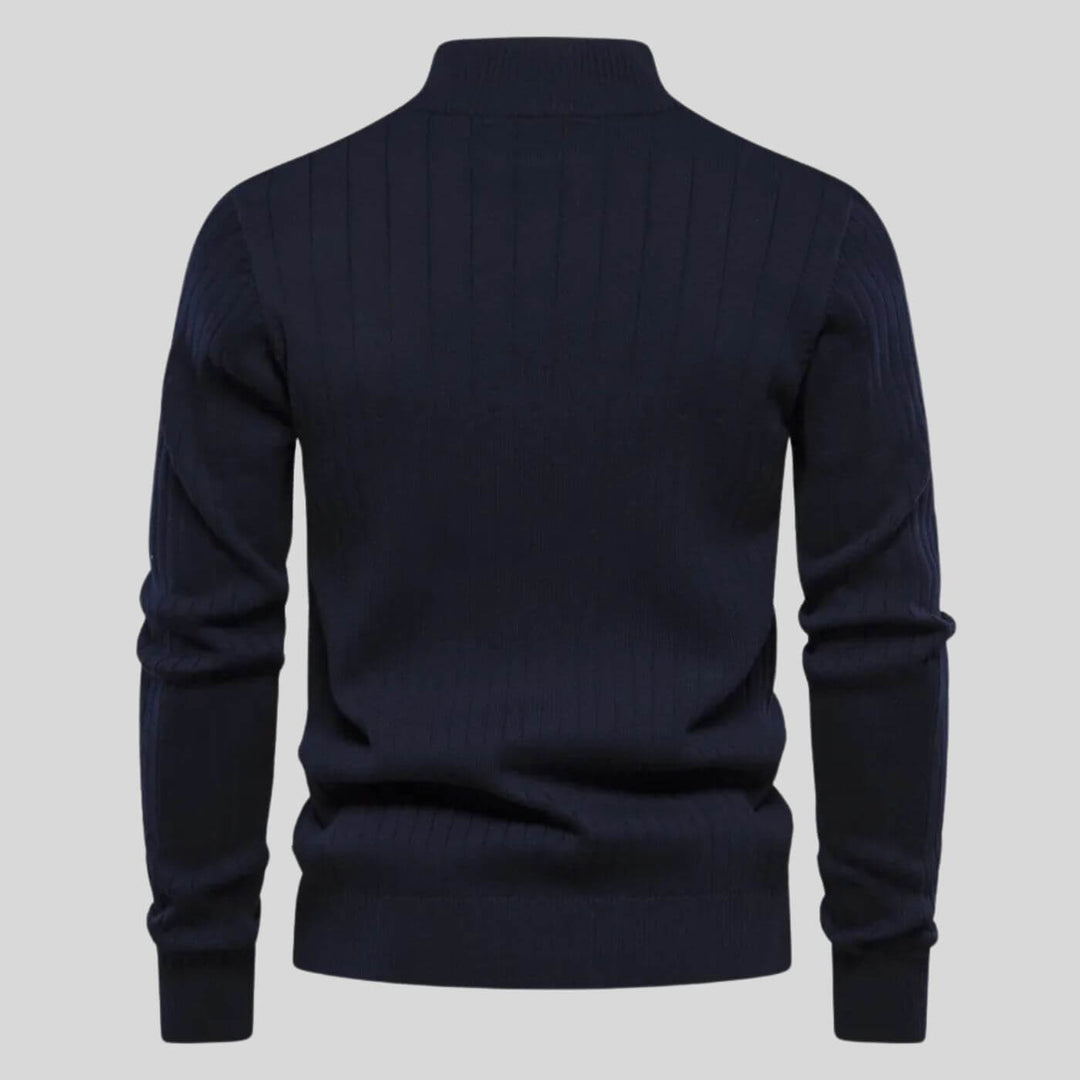 Back view of a navy blue men's ribbed knit half-zip jumper with long sleeves and a fitted hem.