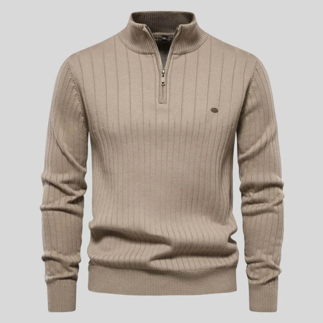 Beige men's ribbed knit jumper featuring a half-zip collar, long sleeves, and a small chest logo detail.