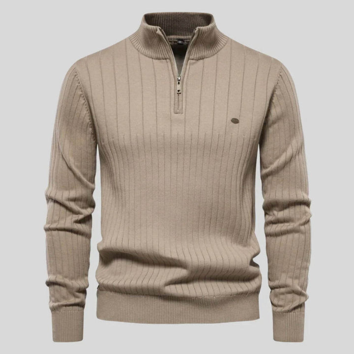 Beige men's ribbed knit jumper featuring a half-zip collar, long sleeves, and a small chest logo detail.