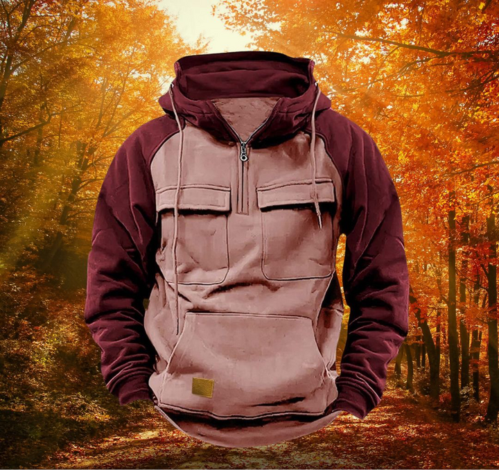 Men's maroon and tan colour-block half-zip utility hoodie with chest flap pockets and a drawstring hood.