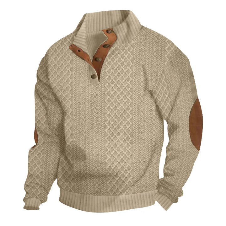 Beige cable knit jumper with a button-up stand collar and brown contrast elbow patches.