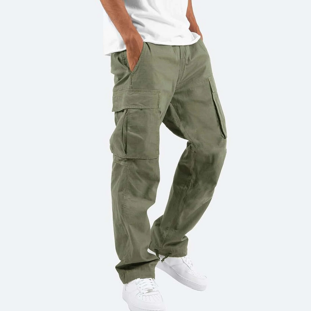 Olive green relaxed-fit cargo trousers with large utility pockets and a straight-leg cut worn with a white t-shirt.