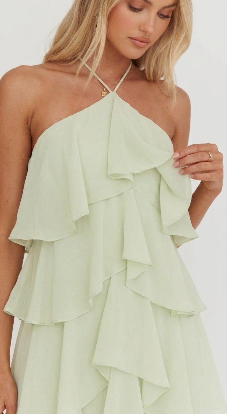 Women's Rosalie floral halter tiered maxi dress in a soft, flowing sage green fabric.