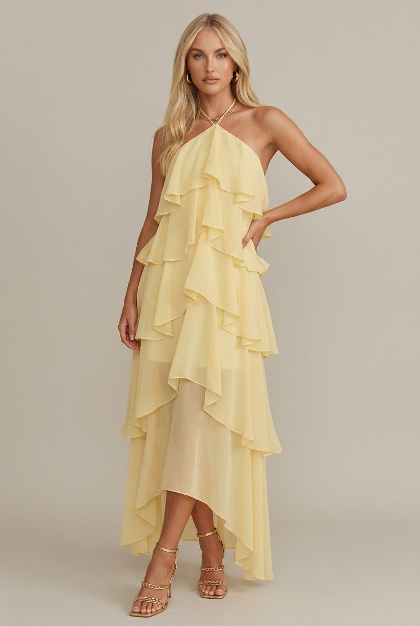 Rosalie women's yellow floral halter tiered maxi dress with flowing ruffles, perfect for warm-weather occasions.