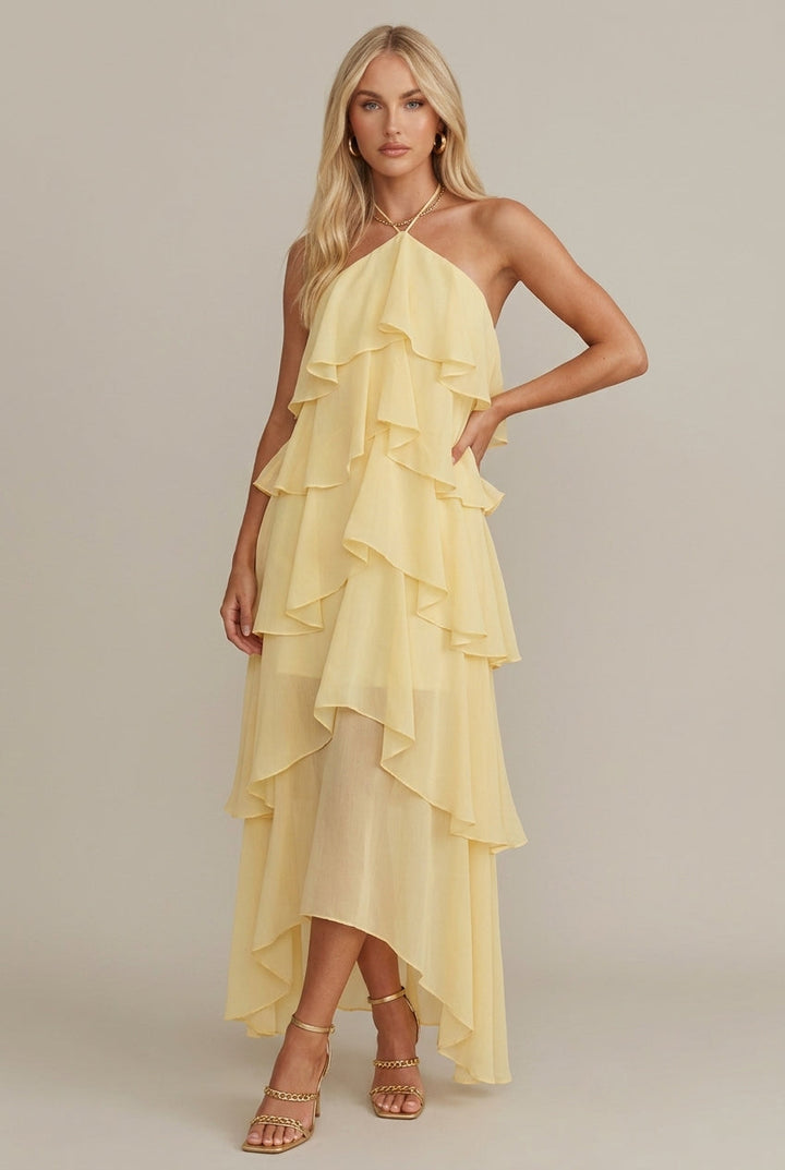 Rosalie women's yellow floral halter tiered maxi dress with flowing ruffles, perfect for warm-weather occasions.