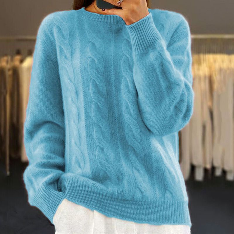 Light blue cable knit crew neck jumper with a relaxed fit, ribbed cuffs, and hem.