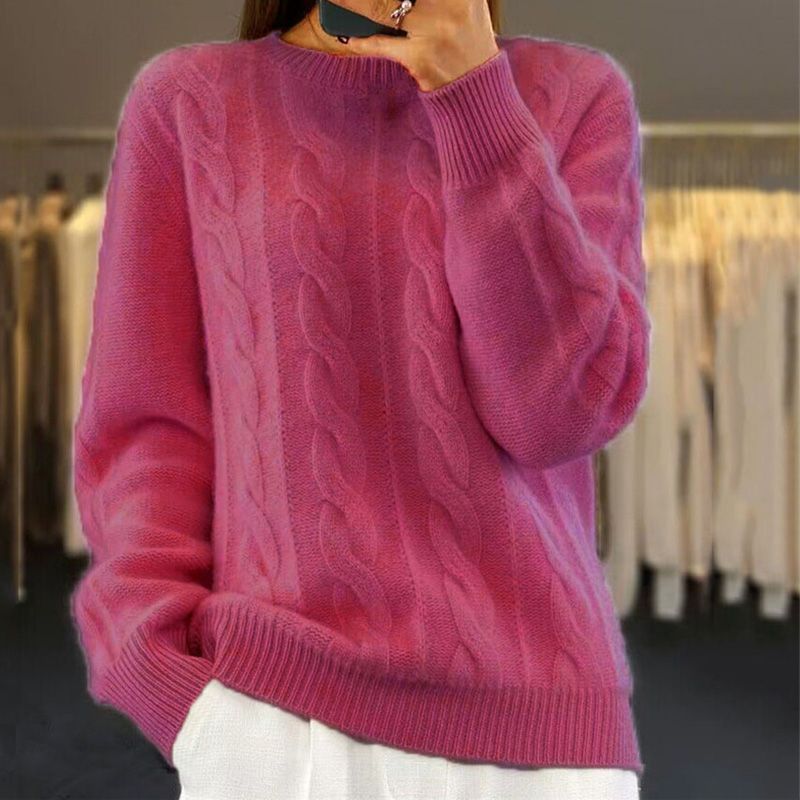 Hot pink cable knit jumper with a crew neckline, ribbed cuffs, and a relaxed fit.