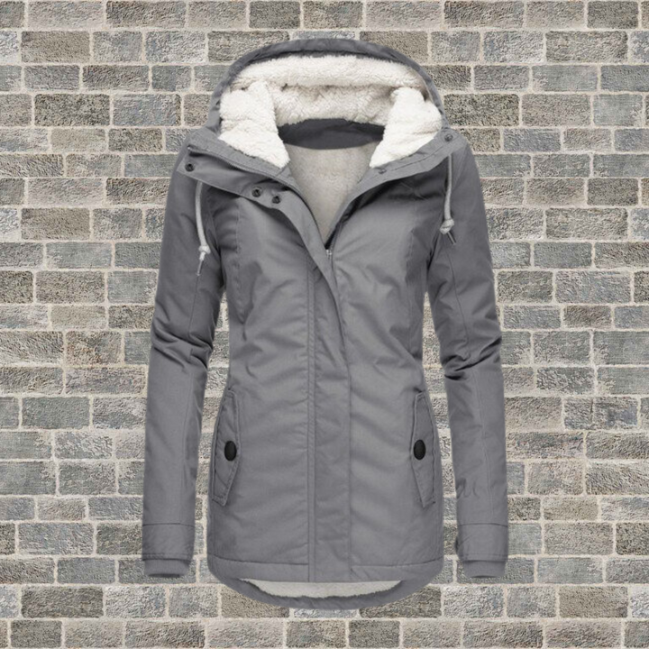 Grey Rosalind parka with a plush white fleece-lined hood, full zip front, and flattering mid-length silhouette.