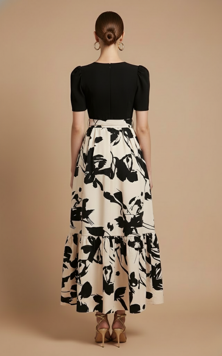Rosalind Women's Short Sleeve Tiered Maxi Dress with black bodice and flowing floral skirt.