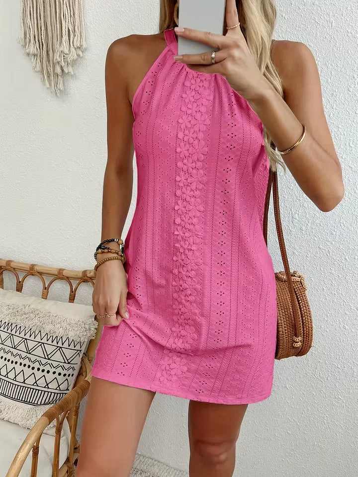 Bright pink eyelet halter mini dress with a floral lace center panel and relaxed A-line silhouette.