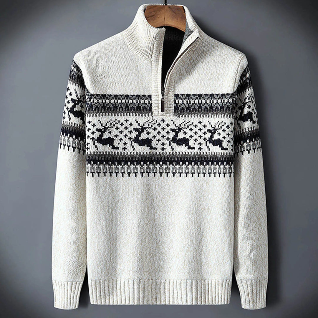 Men's cream knit half-zip jumper featuring a black and grey Fair Isle reindeer pattern across the chest and sleeves.