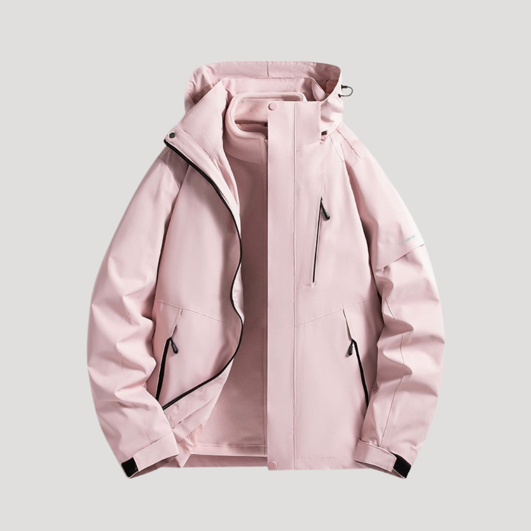 Light pink waterproof hooded windbreaker with zip pockets and a fleece-lined interior for active outdoor wear.