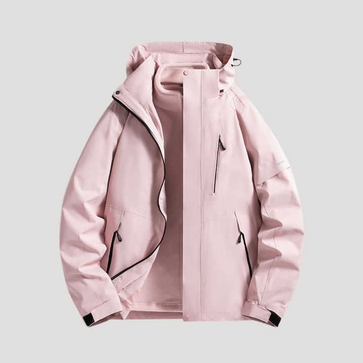 Light pink waterproof hooded windbreaker with zip pockets and a fleece-lined interior for active outdoor wear.