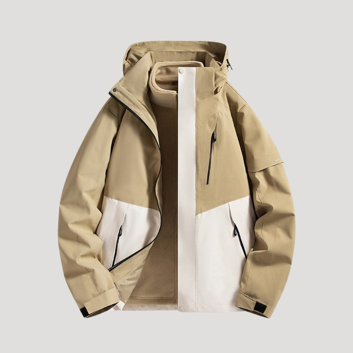 Tan and white waterproof hooded windbreaker jacket with zip pockets and a fleece-lined interior.