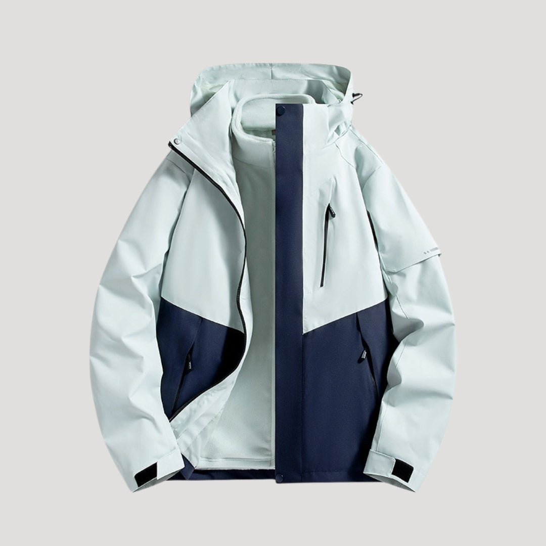 Light blue and navy waterproof hooded windbreaker with zip pockets and a front zipper closure.