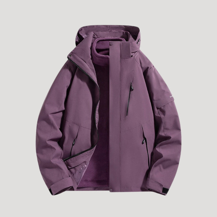 Purple waterproof hooded windbreaker with a fleece lining, zip pockets, and adjustable cuffs for outdoor wear.