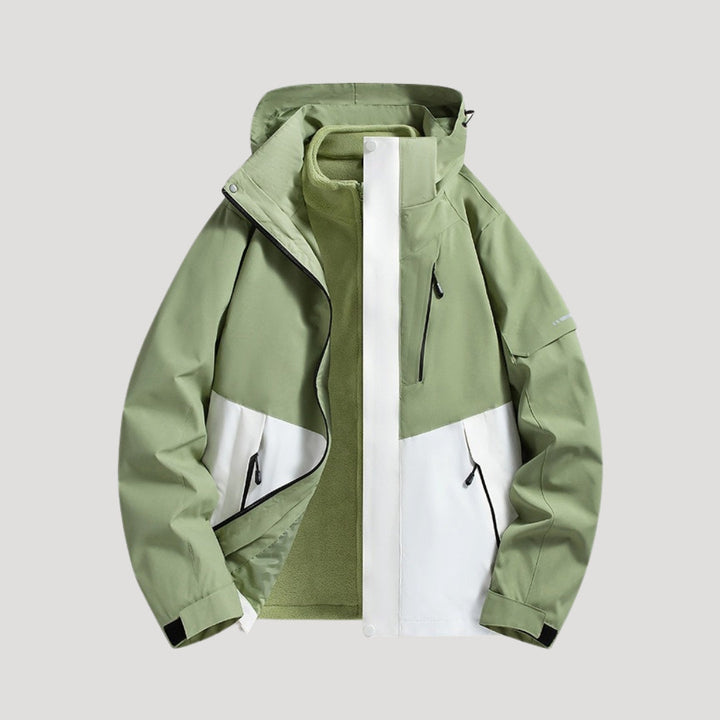 Sage green and white waterproof hooded windbreaker jacket with zip pockets and a fleece-lined interior.