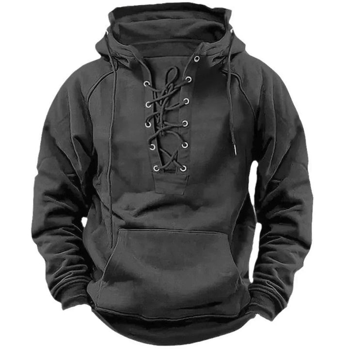 Black men's pullover hoodie featuring a heritage lace-up neckline, metal eyelets, a fixed hood, and a front kangaroo pocket.
