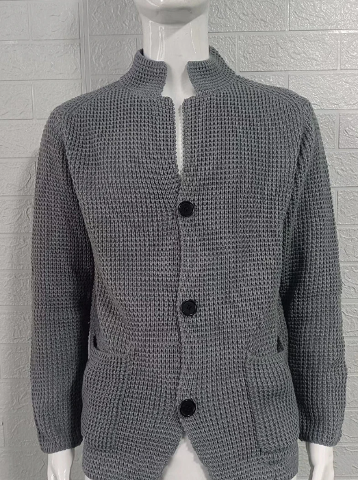 Grey textured knit cardigan with a standing collar, button-through front, and practical pockets for a refined, tailored look.