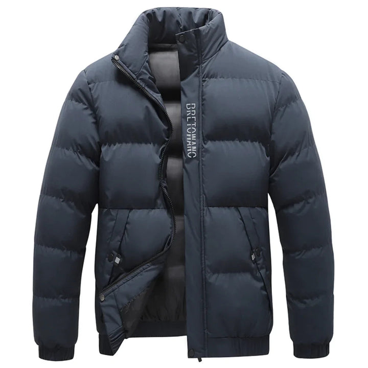 Men's navy blue quilted puffer jacket with a stand collar, full-length zip, and ribbed cuffs for winter warmth.