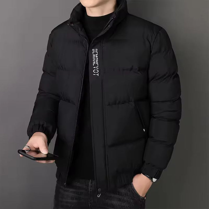 Men's black quilted puffer jacket with a high stand collar, full-length zip, and white chest branding.