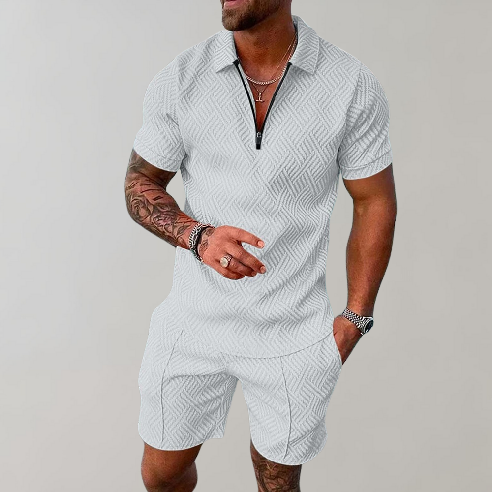 White men's zip-collar polo and shorts set featuring a textured geometric weave pattern.