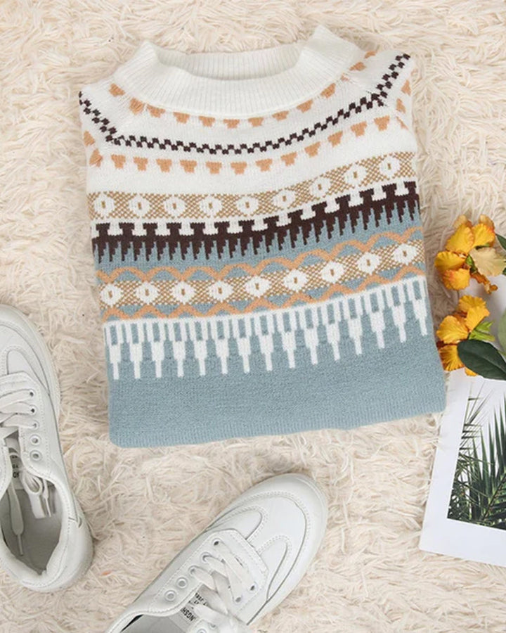 Women's cream and blue Fair Isle crew neck jumper with geometric patterns, ribbed trim, and a soft knit texture.