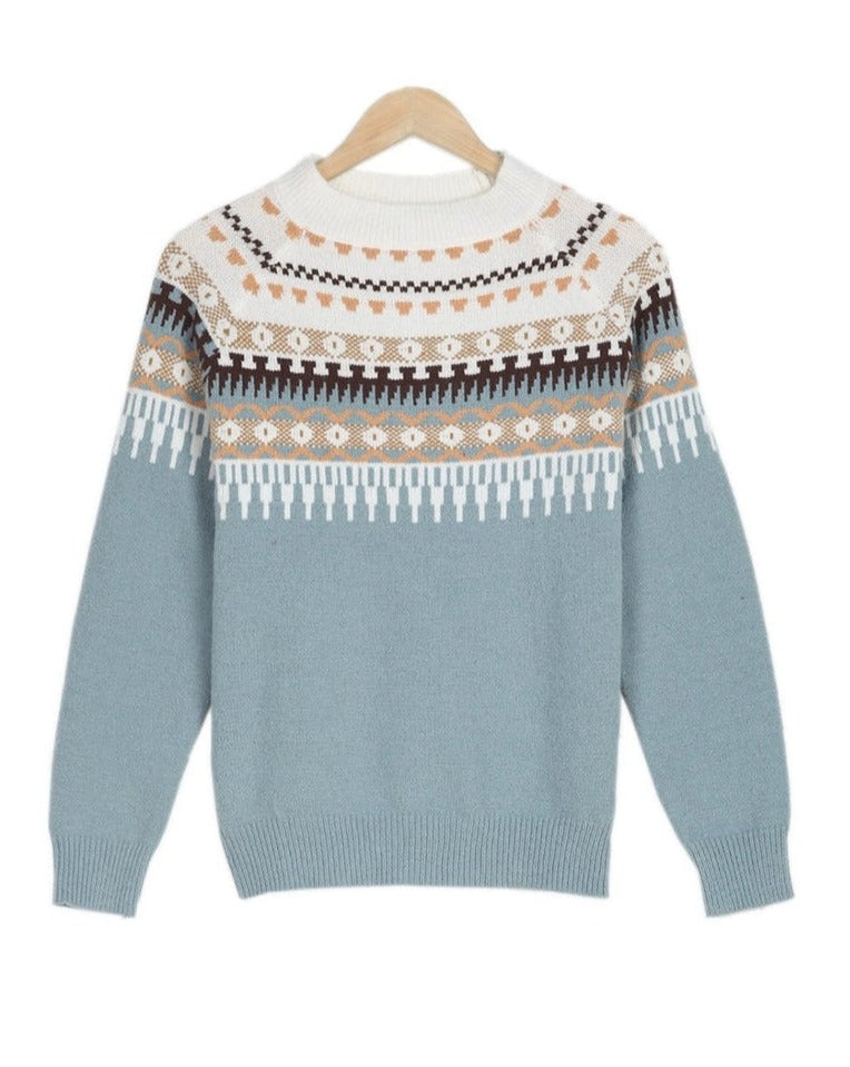 Blue crew neck jumper featuring a white yoke with a multi-colored geometric Fair Isle pattern and ribbed trim.