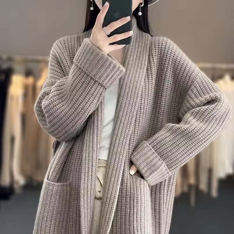 Sophie longline cardigan in a soft, chunky taupe knit with an open front and convenient side pockets.
